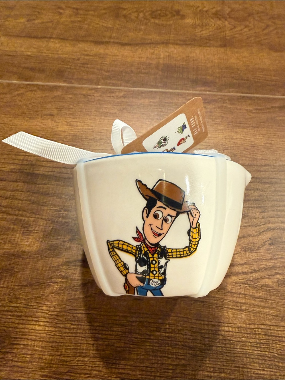 RAE DUNN DISNEY Pixar TOY STORY
Woody Nesting MEASURING CUPS Set
Of 4 (NEW)
